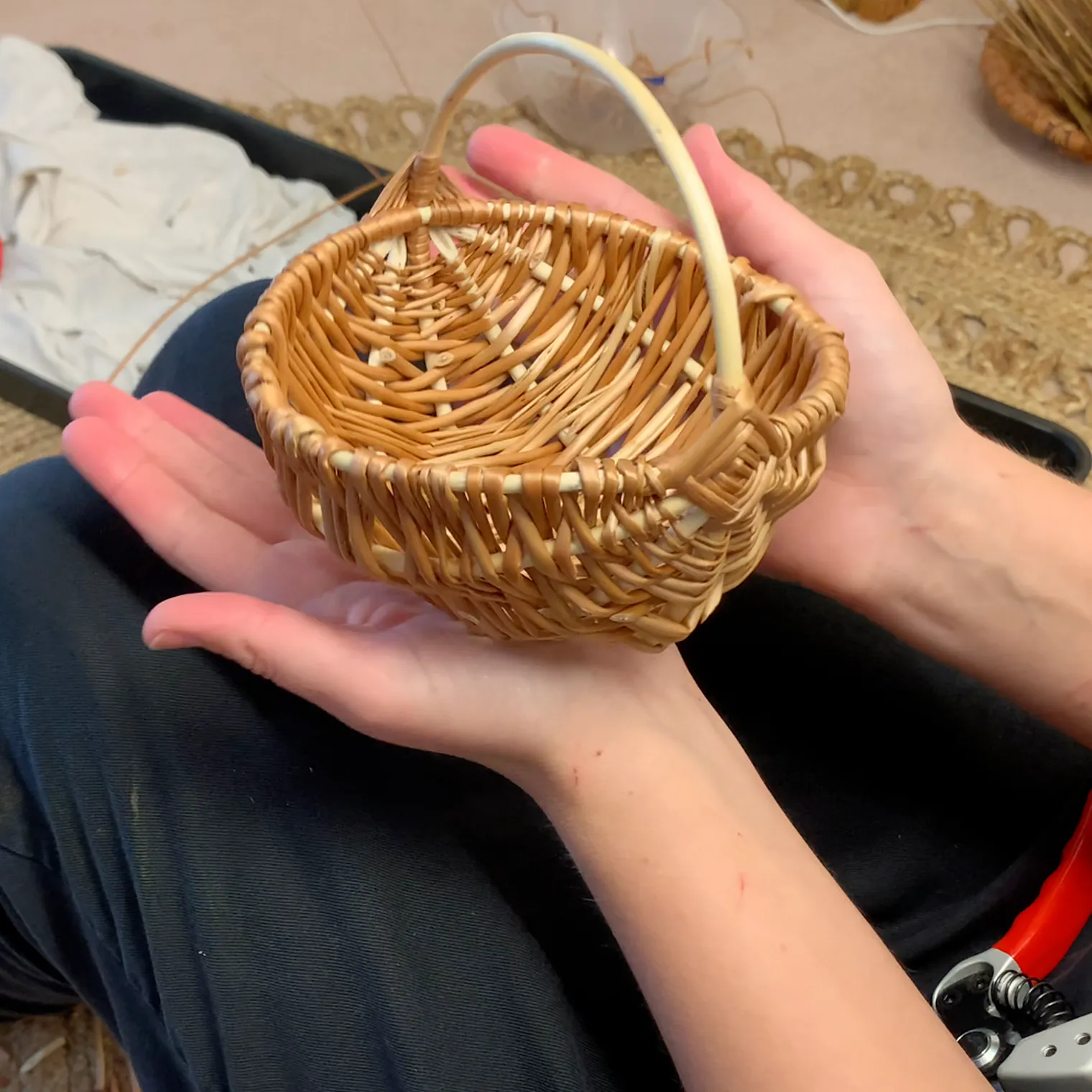 willow frame basket tutorial video still showing the finished willow frame basket