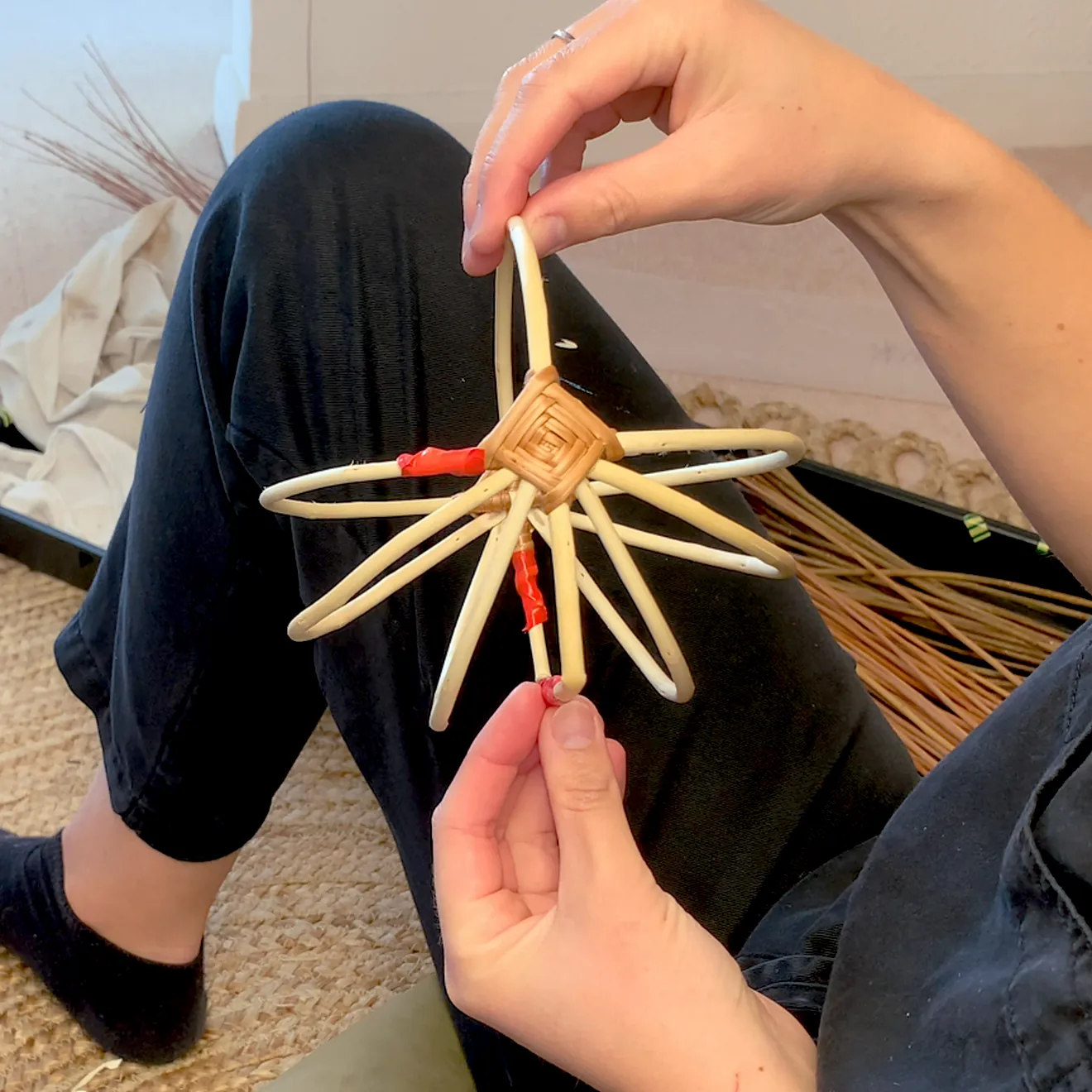 Willow frame basket tutorial video still showing the frame of the basket