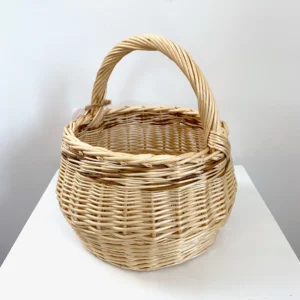 a small white willow foraging or kindling basket with brown willow woven through it also.