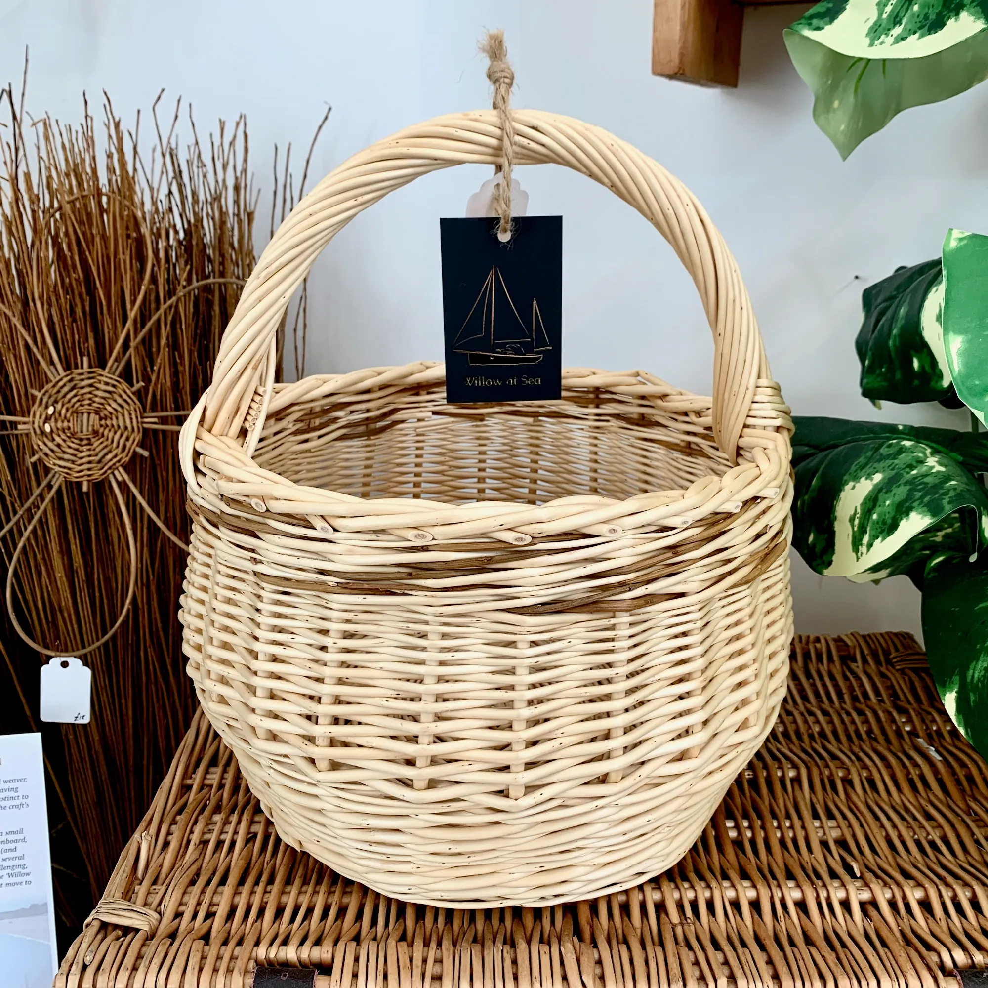 a small white willow foraging or kindling basket with brown willow woven through it also.
