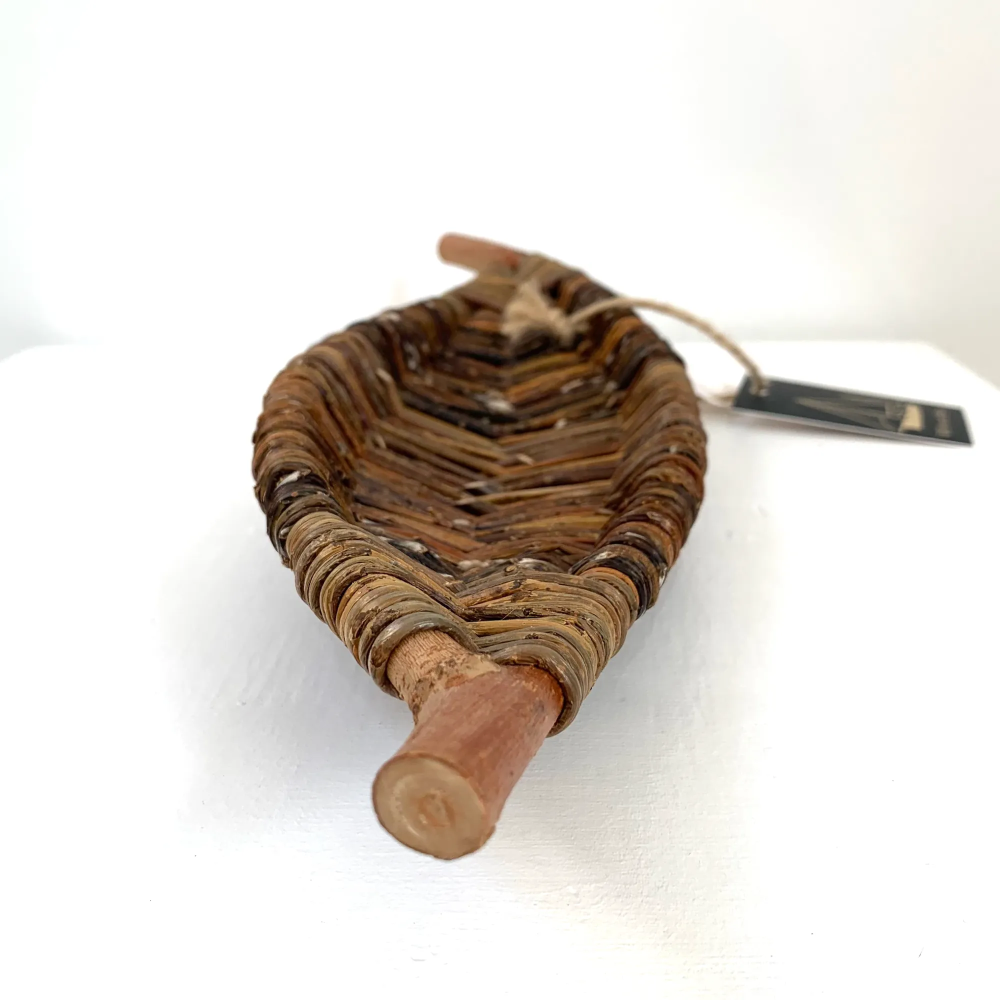 a sculptural long narrow tray in the shape of a leaf made from wild foraged willow