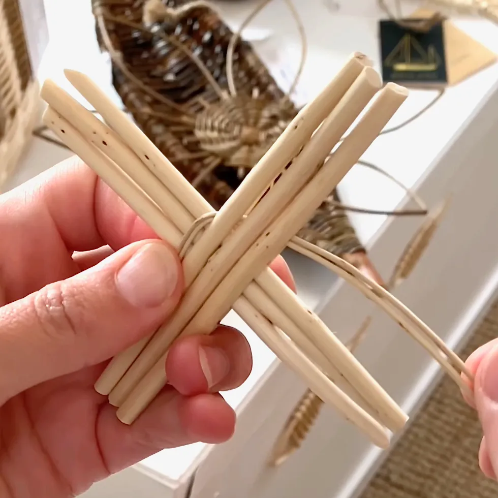willow weaving video tutorial still showing the initial weave of a willow flower